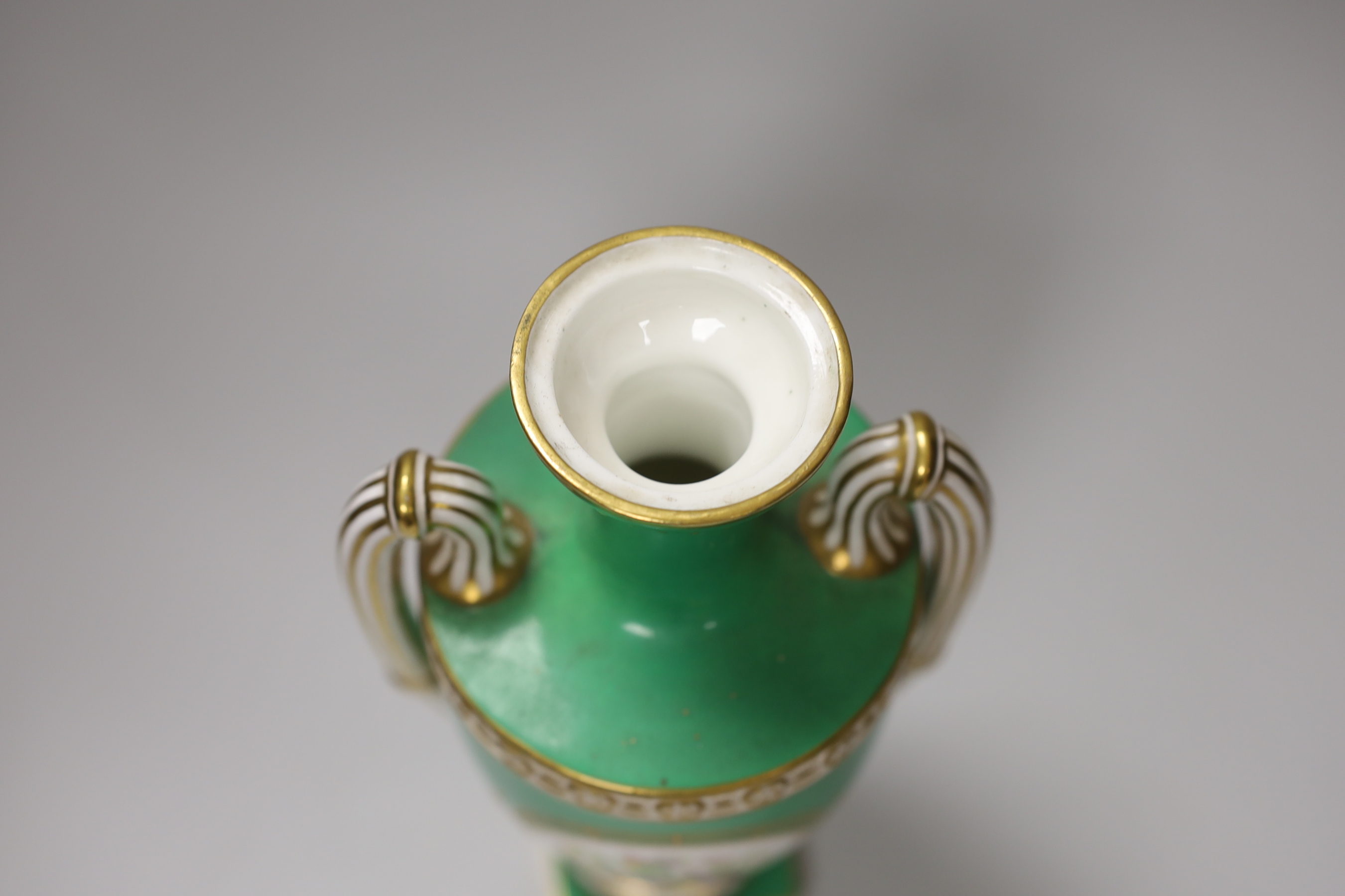 A Coalport two handled green ground vase and cover painted with a landscape, verso with fruit by Cook, 28cm high